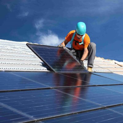 installing alternative energy photovoltaic solar panels on roof